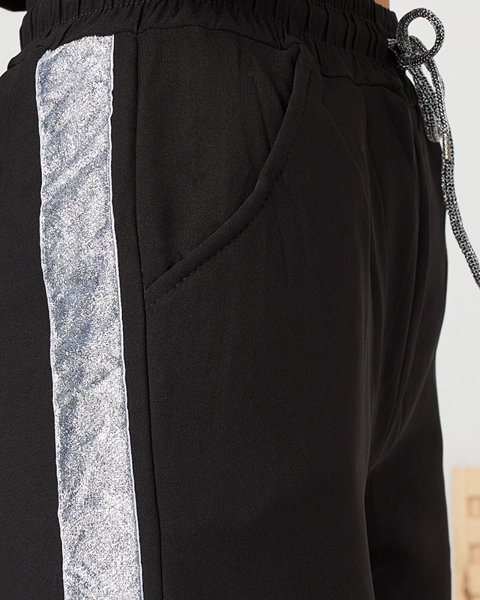Pantalon de survêtement noir isolé pour femmes avec rayures argentées- Vêtements