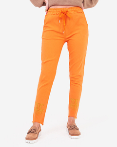 Pantalon femme en tissu orange avec zircons cubiques - Vêtements