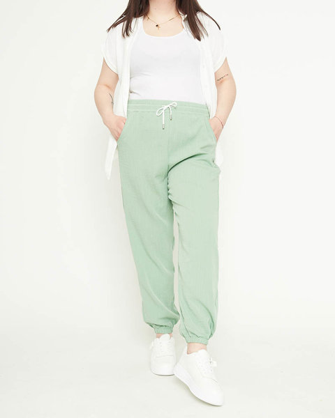 Pantalon femme en tissu vert - Habillement