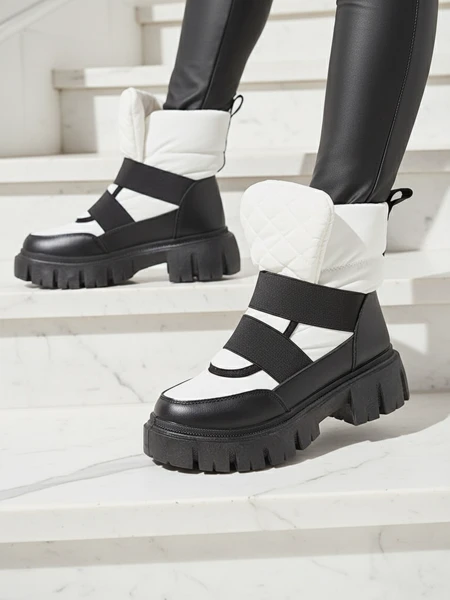 Bottes de neige pour femmes à semelle plate en noir et blanc Ferory- Footwear