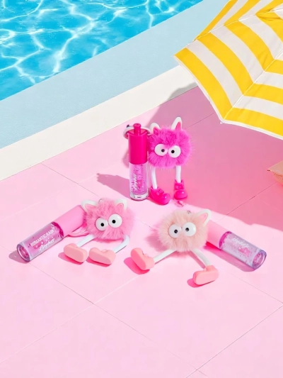 Gloss à lèvres pour enfants avec un monstre duveteux rose foncé