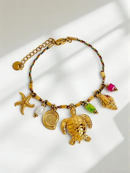 Bracelet Aphrodite Maretta plaqué or avec breloques marines et perle