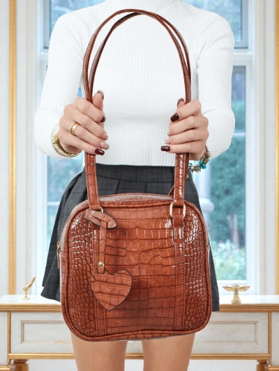 Sac à main Velinne en cuir écologique verni