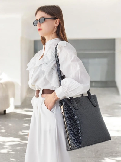 Sac à main en cuir verni pour femmes avec embossage