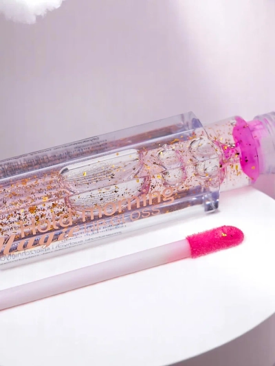 Gloss à lèvres incolore 24K hydratant avec des particules dorées