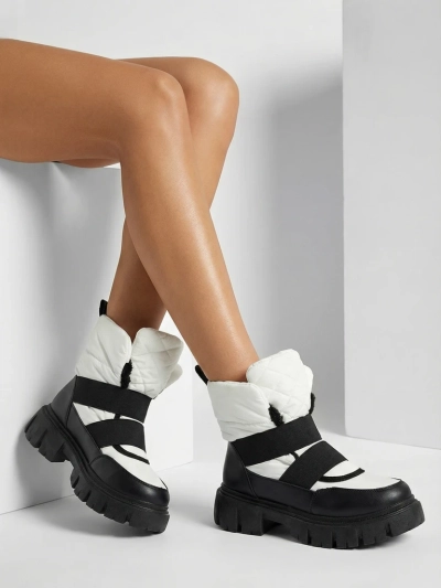 Bottes de neige pour femmes à semelle plate en noir et blanc Ferory- Footwear