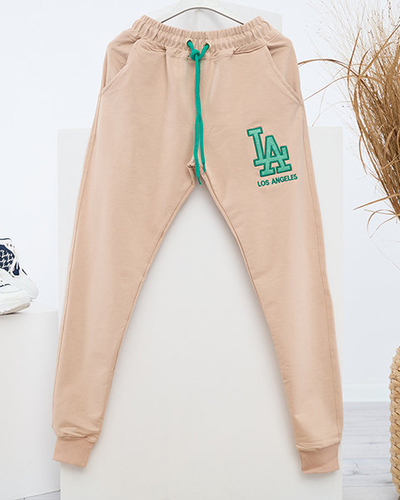 Jogging femme beige avec patch coloré - Vêtements