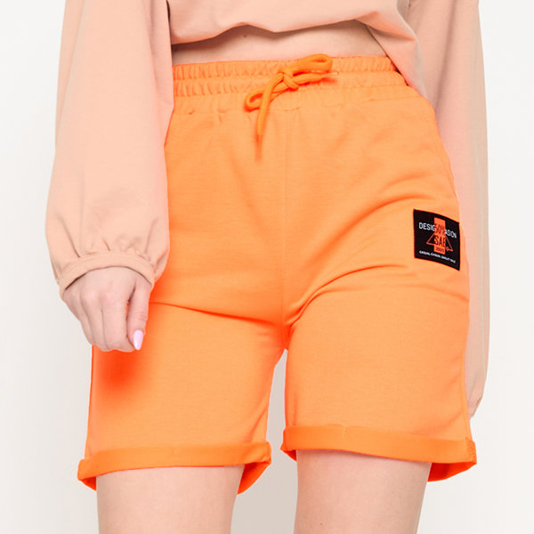 Short femme orange fluo au-dessus du genou - Habillement