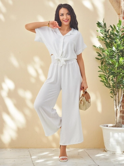 Ensemble Royalfashion pour femmes avec une chemise à manches courtes nouée et un pantalon évasé orné de strass