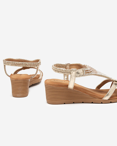 OUTLET Sandales dorées pour femme avec zircons cubiques sur le talon compensé Amuni - Chaussures