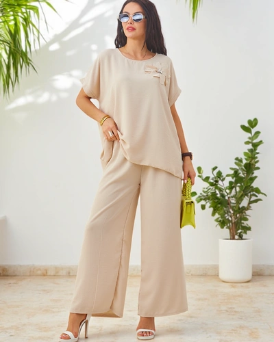 Ensemble Royalfashion pour femmes avec manches courtes, fleur décorative et pantalon large