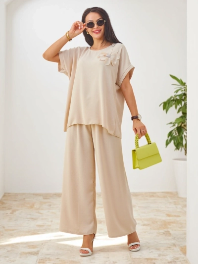 Ensemble Royalfashion pour femmes avec manches courtes, fleur décorative et pantalon large