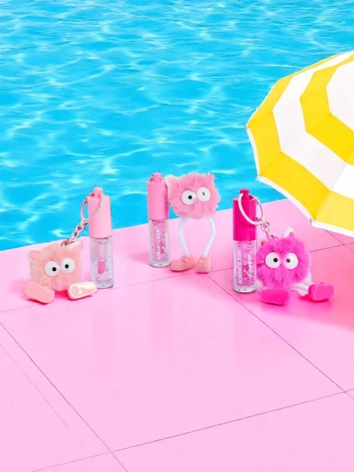 Gloss à lèvres pour enfants avec un monstre duveteux rose foncé