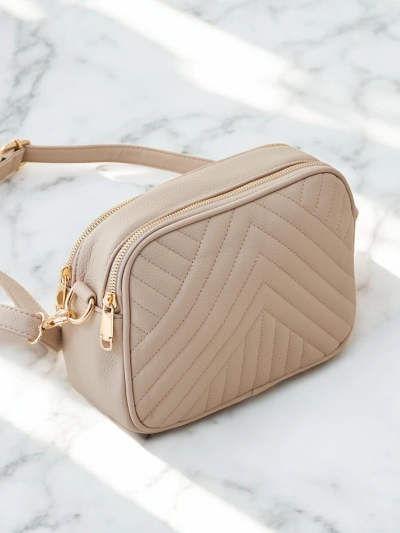 Royalfashion Petit sac à main ovale pour femmes en éco-cuir matelassé