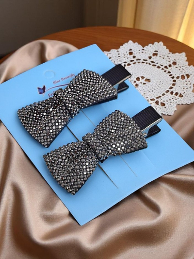 Royalfashion Lot de 2 barrettes avec nœuds et strass Isadora