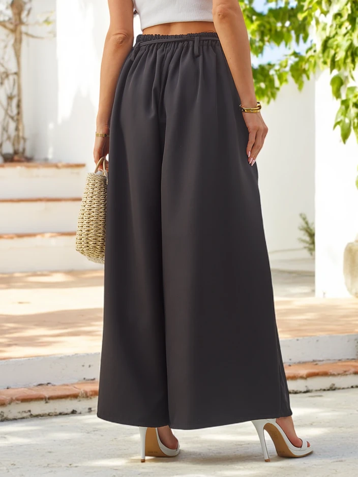 Pantalons larges élégants pour femmes avec une fleur décorative à la ceinture