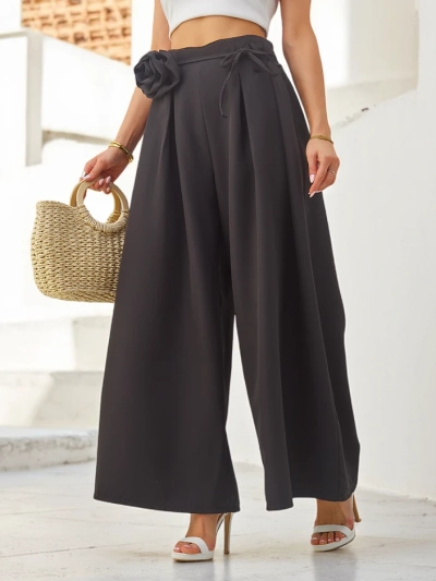 Pantalons larges élégants pour femmes avec une fleur décorative à la ceinture