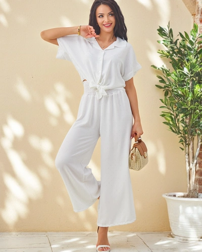 Ensemble Royalfashion pour femmes avec une chemise à manches courtes nouée et un pantalon évasé orné de strass