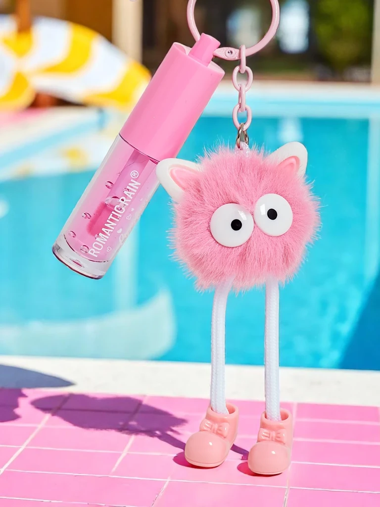 Gloss à lèvres pour enfants avec un monstre duveteux rose foncé