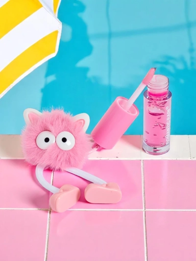 Gloss à lèvres pour enfants avec un monstre duveteux rose foncé