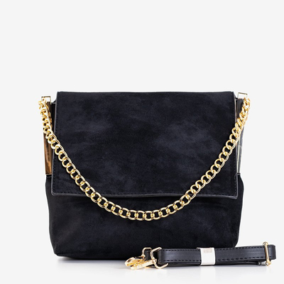 Un petit sac à main noir sur une chaîne - Sacs à main