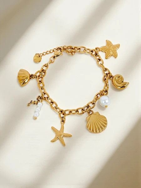 Bracelet Aphrodite Maretta plaqué or avec breloques marines et perle