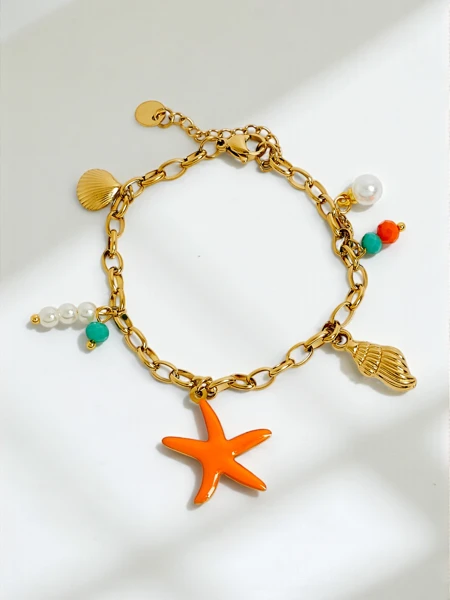 Bracelet Callista Mare – chaîne dorée avec coquillages et étoile de mer
