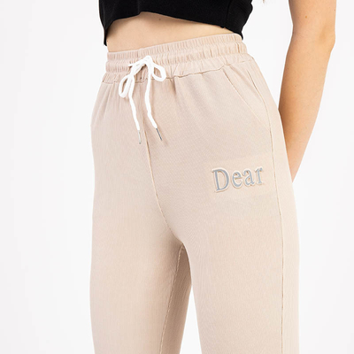 Pantalon femme en tissu beige avec écusson - Vêtements