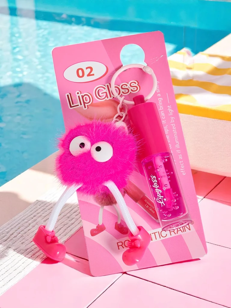 Gloss à lèvres pour enfants avec un monstre duveteux Fuchsia
